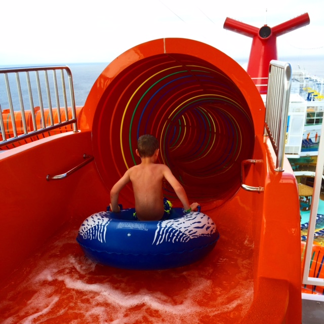 Carnival Cruises Vista cruise ship waterslide red entrance with boy
