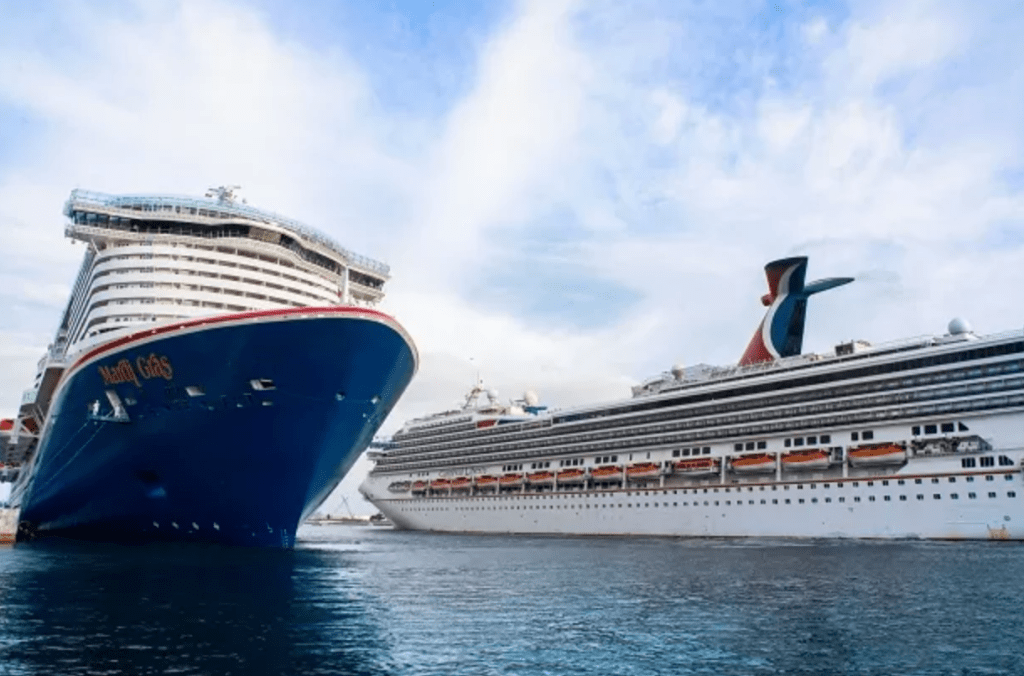 Carnival Cruise Line Mardi Gras arrives in Port Canaveral escorted by Carnival Liberty